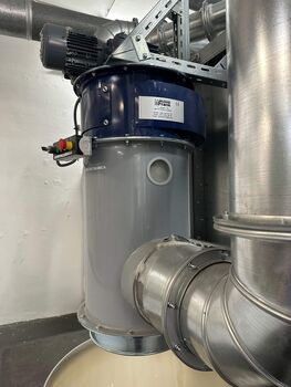 Side view of fiber compactor for compressed waste handling